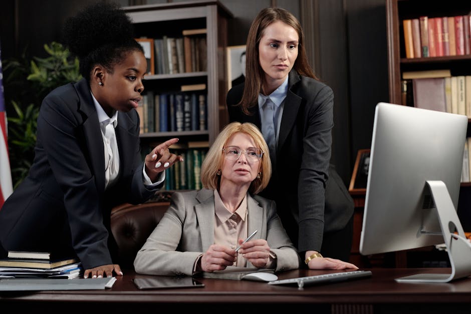 A professional-looking image showcasing a law firm office with legal books, a computer, and a lawyer's desk with legal documents spread out. The office is well-lit and organized, conveying a sense of expertise and success.